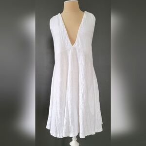 FREE PEOPLE MOVEMENT BEACH V- Neck Halter mini dress. Size: L